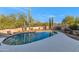 Inviting kidney-shaped pool with a spacious patio and desert landscaping at 5743 E Windstone Trl, Cave Creek, AZ 85331