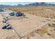 Aerial view of house on a large lot with a chain link fence at 57968 W Fulcar Rd, Maricopa, AZ 85139