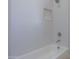 Clean bathroom with a bathtub, shower, and tiled walls at 57968 W Fulcar Rd, Maricopa, AZ 85139