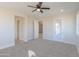 Spacious bedroom with access to another room and outdoor access at 57968 W Fulcar Rd, Maricopa, AZ 85139