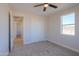 Bedroom with a window and sliding door closet at 57968 W Fulcar Rd, Maricopa, AZ 85139