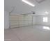 Spacious two-car garage with ample storage space at 57968 W Fulcar Rd, Maricopa, AZ 85139