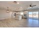 Modern kitchen with white cabinets, stainless steel appliances, and an island at 57968 W Fulcar Rd, Maricopa, AZ 85139