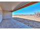 Covered patio with views of the desert landscape at 57968 W Fulcar Rd, Maricopa, AZ 85139