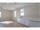 Modern wet bar with white cabinets and quartz countertops at 57968 W Fulcar Rd, Maricopa, AZ 85139