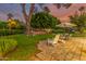 Landscaped backyard with lawn games and seating at 5801 E Exeter Blvd, Phoenix, AZ 85018