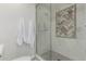 Modern bathroom with a walk-in shower and marble tile at 5801 E Exeter Blvd, Phoenix, AZ 85018