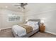 Spacious bedroom with a queen bed, nightstands, and ceiling fan at 5801 E Exeter Blvd, Phoenix, AZ 85018