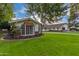 Charming mid-century modern home with a well-manicured lawn and mature landscaping at 5801 E Exeter Blvd, Phoenix, AZ 85018