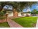 Brick home with grassy yard and walkway at 5801 E Exeter Blvd, Phoenix, AZ 85018