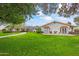 Attractive ranch house with a manicured lawn and walkway at 5801 E Exeter Blvd, Phoenix, AZ 85018