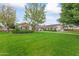 Ranch-style home with a large front yard and walkway at 5801 E Exeter Blvd, Phoenix, AZ 85018