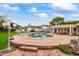 Inviting pool area with brick patio, lounge chairs, and outdoor dining space at 5801 E Exeter Blvd, Phoenix, AZ 85018