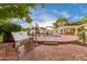 Brick pool patio with built-in grill and ample space for entertaining at 5801 E Exeter Blvd, Phoenix, AZ 85018