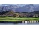 Community golf course with lake, mountains in the background at 6307 S Palo Blanco Dr, Gold Canyon, AZ 85118