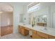 Bathroom with double sinks, wood cabinets and shower at 6307 S Palo Blanco Dr, Gold Canyon, AZ 85118