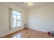 Bright bedroom with wood floors and large window at 6307 S Palo Blanco Dr, Gold Canyon, AZ 85118