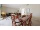 Dining room with a wooden table, chairs, and view into the living room at 6318 N 19Th St, Phoenix, AZ 85016