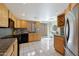 Kitchen with light wood cabinets, granite countertops, and stainless steel appliances at 6318 N 19Th St, Phoenix, AZ 85016