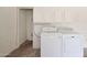 Laundry room with washer, dryer, and overhead cabinets at 6318 N 19Th St, Phoenix, AZ 85016