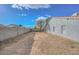 Backyard view of the house, showing a tree and a block wall at 6339 W Ironwood W Dr, Glendale, AZ 85302