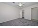 Spacious bedroom with grey carpet and a ceiling fan at 6339 W Ironwood W Dr, Glendale, AZ 85302