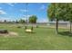 Dog park with grassy area, tunnels, and benches at 6339 W Ironwood W Dr, Glendale, AZ 85302