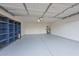 Garage interior with storage shelving and epoxy flooring at 6339 W Ironwood W Dr, Glendale, AZ 85302