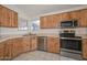 Kitchen features wood cabinets and stainless steel appliances at 6339 W Ironwood W Dr, Glendale, AZ 85302