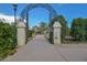 Ornate entrance to a park with mature landscaping at 6339 W Ironwood W Dr, Glendale, AZ 85302