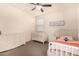 Bright bedroom with two beds, nightstands, and ample closet space at 653 N Abalone Dr, Gilbert, AZ 85233