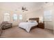 Spacious bedroom with large windows and ceiling fan at 653 N Abalone Dr, Gilbert, AZ 85233