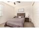 Spacious bedroom with a queen bed, nightstands, and large closet at 653 N Abalone Dr, Gilbert, AZ 85233