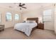 Bright and airy bedroom with a ceiling fan and wooden bed frame at 653 N Abalone Dr, Gilbert, AZ 85233