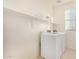 Laundry room with washer, dryer, and overhead shelving at 653 N Abalone Dr, Gilbert, AZ 85233