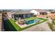 Aerial view of a home with a luxurious pool and patio area at 6551 N 127Th Dr, Glendale, AZ 85307