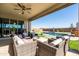 Covered patio with wicker furniture and a view of the pool at 6551 N 127Th Dr, Glendale, AZ 85307