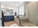 Spa-like bathroom with walk-in shower, soaking tub, and modern vanity at 6551 N 127Th Dr, Glendale, AZ 85307