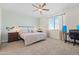 Spacious bedroom with carpeted floor and home office at 6551 N 127Th Dr, Glendale, AZ 85307