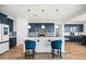 Modern kitchen with white countertops, blue cabinetry, and an island at 6551 N 127Th Dr, Glendale, AZ 85307