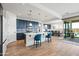 Modern kitchen with blue cabinets, island, and stainless steel appliances at 6551 N 127Th Dr, Glendale, AZ 85307