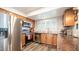 Modern kitchen with stainless steel appliances and wood cabinets at 7710 W Aster Dr, Peoria, AZ 85381