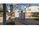 Gray storage shed with double doors in backyard at 7710 W Aster Dr, Peoria, AZ 85381