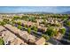 Aerial view of a residential area with mountain views at 7844 W Bonitos Dr, Phoenix, AZ 85035