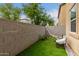 Artificial turf backyard with hammock and chair at 7844 W Bonitos Dr, Phoenix, AZ 85035