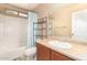 Clean bathroom with a tub, toilet, and vanity at 7844 W Bonitos Dr, Phoenix, AZ 85035