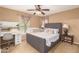 Bedroom with gray upholstered bed and crib at 7844 W Bonitos Dr, Phoenix, AZ 85035