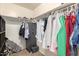 Spacious walk-in closet with shelving and hanging rods at 7844 W Bonitos Dr, Phoenix, AZ 85035