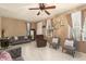 Living room with tiled floors and comfortable seating at 7844 W Bonitos Dr, Phoenix, AZ 85035