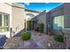 A charming courtyard entry with a stone path and drought-tolerant landscaping at 7878 E Gainey Ranch Rd # 3, Scottsdale, AZ 85258